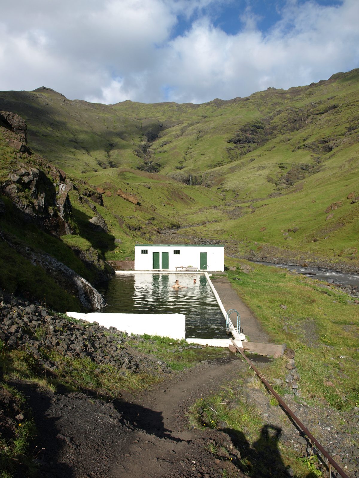Seljavallalaug, a historic spring-fed pool set into the mountainside in South Iceland